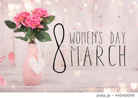 Flowers composition for Women's Day. Pink flowers on old white wooden background. 44040699