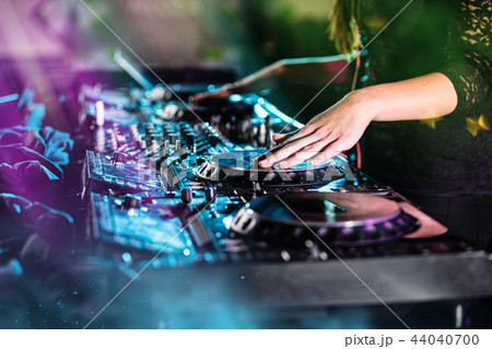 Dj mixes the track in the nightclub at a party 44040700