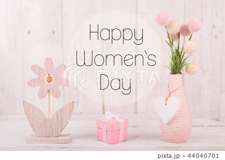 Flowers composition for Women's Day. Pink flowers on old white wooden background. 44040701