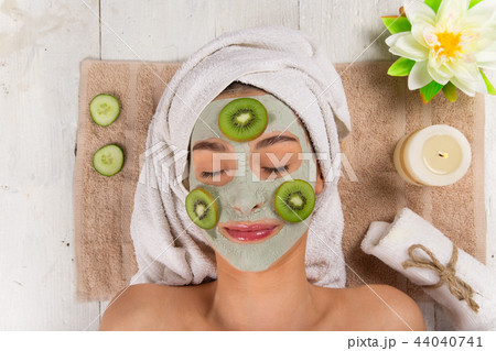 Young healthy woman with face clay mask. 44040741