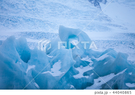 Icebergs swimming on frozen water, close-up. 44040865