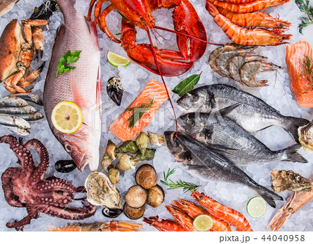 Fresh tasty seafood served on old wooden table. 44040958