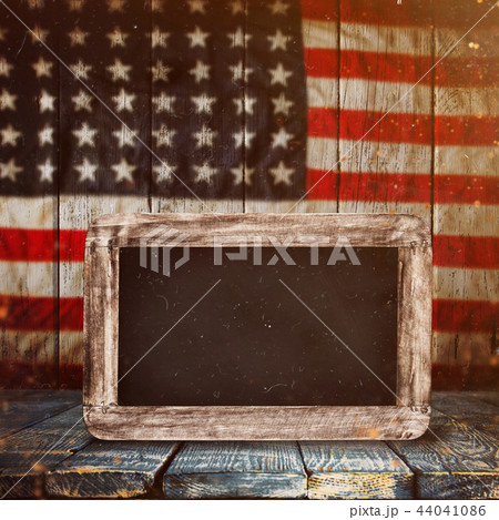 Empty wooden table over vintage USA flag background. 44041086