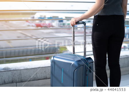 Young woman with suitcase in airtport 44041553