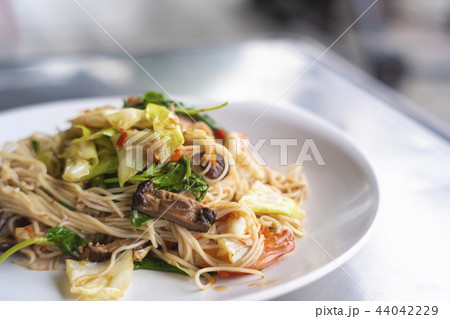 Stir-fried Kee mao pasta in Thai street food Stir-fried Kee mao pasta in Thai street food 44042229