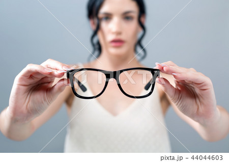 Young woman with eye glasses Young woman with eye glasses 44044603