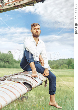 a man on the background of an old plane 44045499