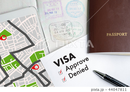 Visa and passport to approved stamped on a  44047811
