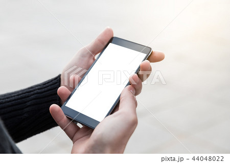 Man uses his mobile phone outdoor. Man uses his mobile phone outdoor. 44048022