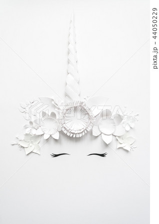 Cute unicorn made of white paper flowers 44050229