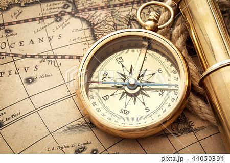 antique compass, spyglass on map antique compass, spyglass on map 44050394