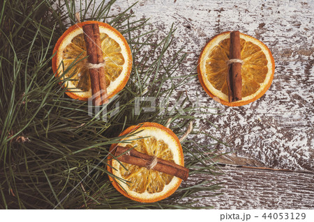 pine branches, dried orange and cinnamon sticks 44053129