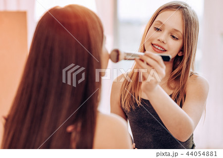 Beautiful girl dreaming to become makeup artist 44054881