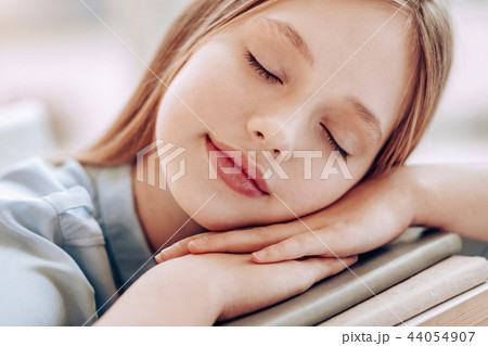 Close up of dreamy girl that keeping eyes closed 44054907