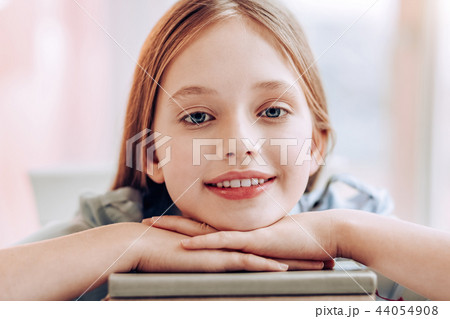 Portrait of charming girl that looking straight at camera 44054908