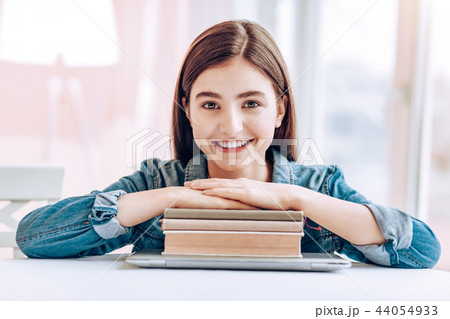 Amazing female person holding hands on books Amazing female person holding hands on books 44054933