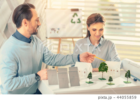 Concentrated woman creating model of comfort building 44055859
