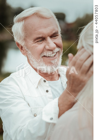 Happy bearded man enjoying pleasant communication with his wife 44057803
