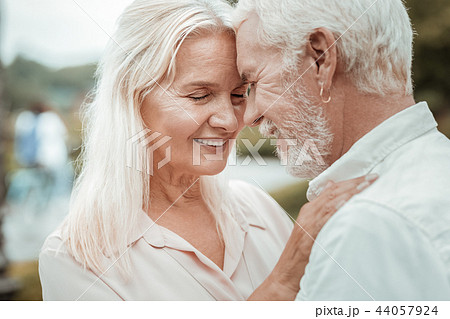 Close up of charming woman that keeping eyes closed Close up of charming woman that keeping eyes closed 44057924