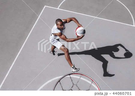 Picture of young confused african basketball player practicing Picture of young confused african basketball player practicing 44060701