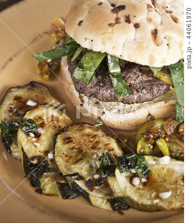 Burger with Onion Bun and Baked Zuchinni 44061970