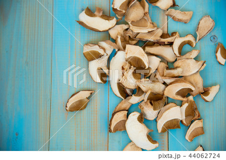 dried mushrooms on old wooden blue background 44062724