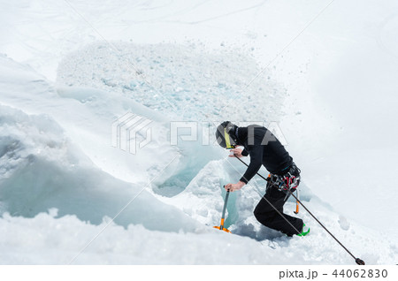 Mountain guide candidate training ice axe and rope skills on a glacier in the North Caucasus 44062830