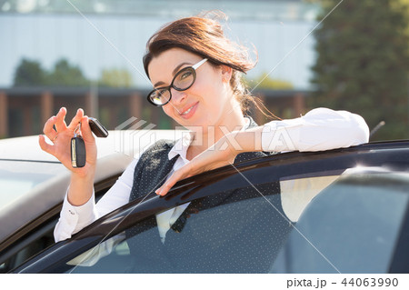 Young business woman portrait in her car Young business woman portrait in her car 44063990