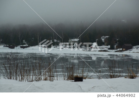 Lion's Head harbour with melting ice and seagulls on the bay ref 44064902