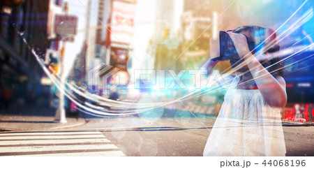 Composite image of girl wearing virtual reality simulator Composite image of girl wearing virtual reality simulator 44068196