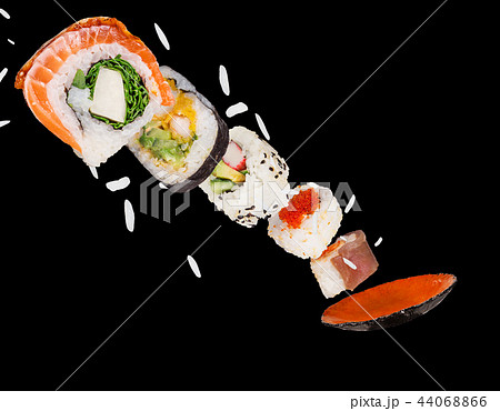 Pieces of delicious japanese sushi frozen in the air. 44068866