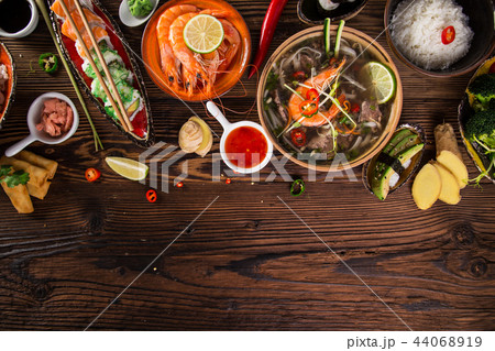 Various of asian meals on rustic background , top view , place for text. Various of asian meals on rustic background , top view , place for text. 44068919