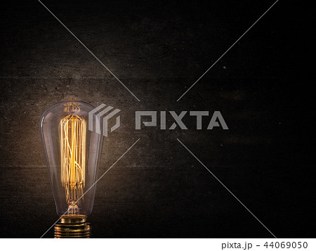 Vintage Edison light bulb on dark background. 44069050