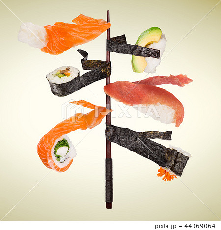 Pieces of delicious japanese sushi frozen in the air. 44069064