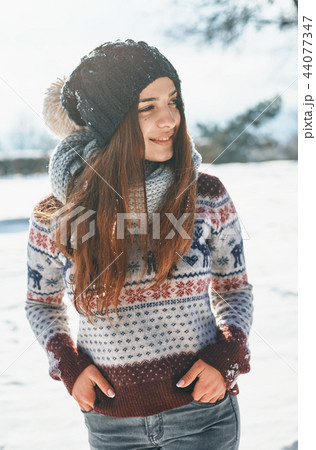 a Beautiful young woman in winter outside 44077347