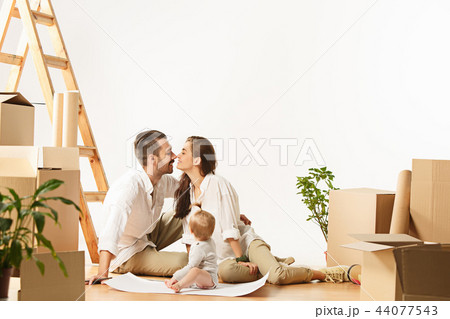 Couple moving to a new home - Happy married people buy a new apartment to start new life together 44077543