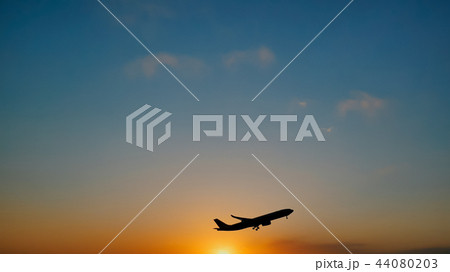 Plane taking off sky sunset sun dusk in airport Plane taking off sky sunset sun dusk in airport 44080203
