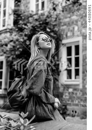 Young lady in jeans jacket on medieval street of Bremen Young lady in jeans jacket on medieval street of Bremen 44080691