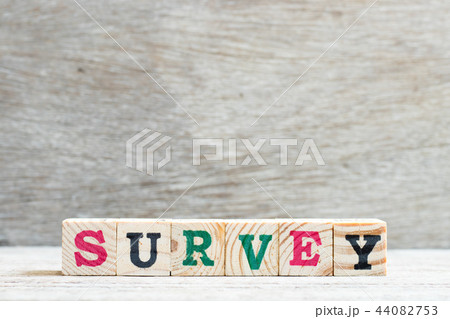 Letter block in word survey on wood background Letter block in word survey on wood background 44082753