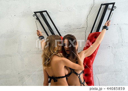 Two girls perfoming erotic play cropped shot Two girls perfoming erotic play cropped shot 44085859