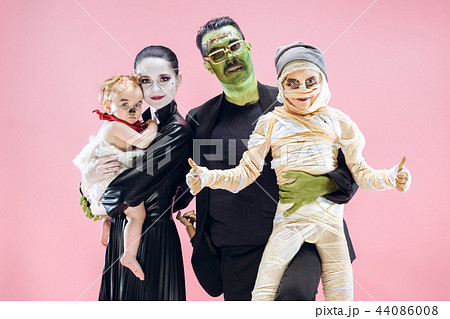Halloween Family. Happy Father, Mother and Children Girls in Halloween Costume and Makeup 44086008