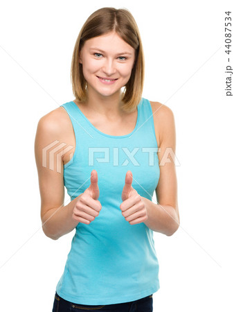 Woman is showing thumb up gesture Woman is showing thumb up gesture 44087534