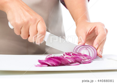 Cook is chopping onion Cook is chopping onion 44088081
