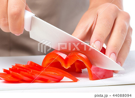 Cook is chopping bell pepper Cook is chopping bell pepper 44088094