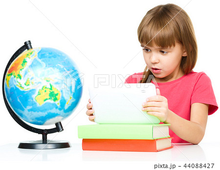 Young girl is using tablet 44088427