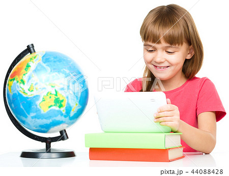 Young girl is using tablet Young girl is using tablet 44088428