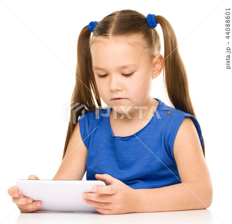 Young girl is using tablet 44088601
