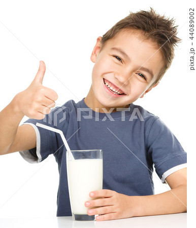 Cute boy with a glass of milk Cute boy with a glass of milk 44089002