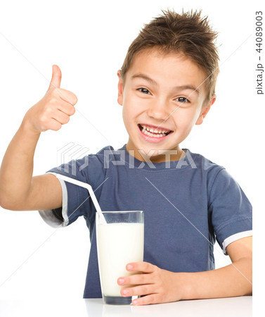 Cute boy with a glass of milk Cute boy with a glass of milk 44089003