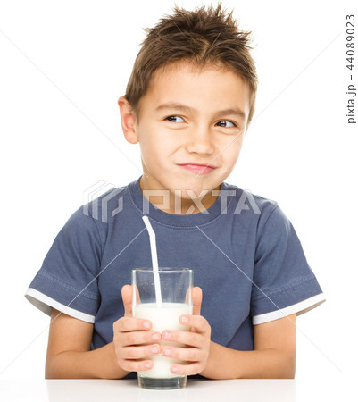 Cute boy with a glass of milk Cute boy with a glass of milk 44089023